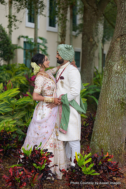 Indian bride and groom looking to each other with love