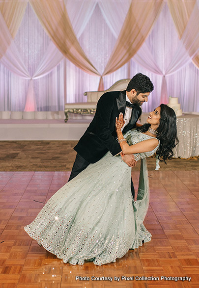 Indian bride and groom performing their dance in their reception Ceremony