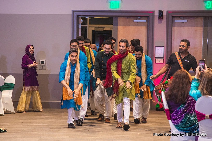 Indian groom giving dance performance with their friends