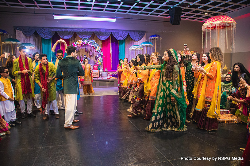 Indian couple giving dance performance with their friends