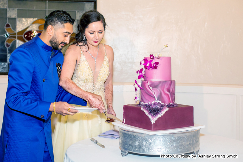 Bride and Groom Slicing the cake together