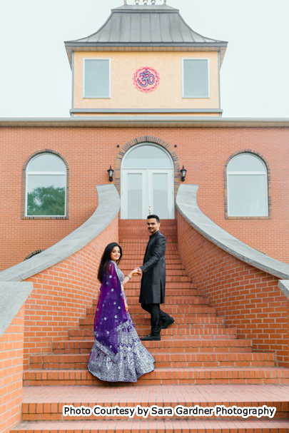 Indian wedding couple possing for outdoor photoshoot