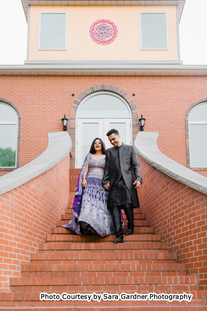 Indian wedding couple possing for outdoor photoshoot