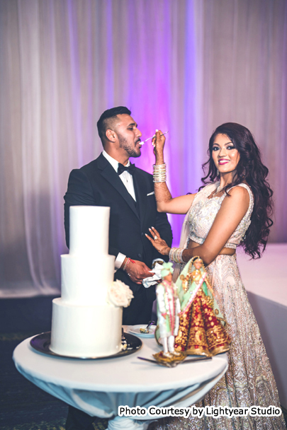 Bride and Groom Slicing the cake together