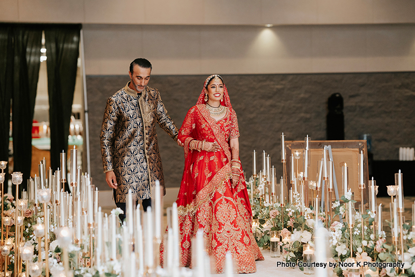 Bride enter into the marriage hall with her parent