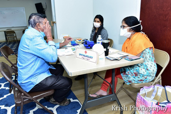 Doctor examines Patient Sai Health Fair - Doctor examines Patient