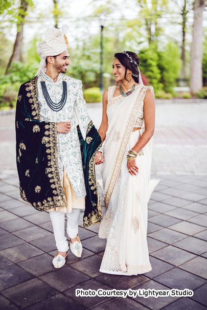 Indian wedding couples Janisha and Ronak possing for outdoor photoshoot