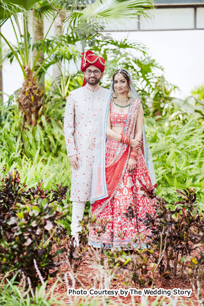 Indian wedding couples Neha and Vishal possing for outdoor photoshoot