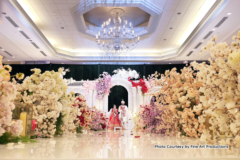 Indian Wedding Couple at beautifully decorated at marriage hall