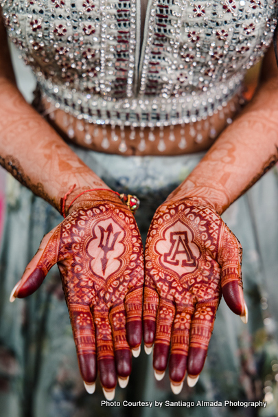 Indian bride showing her mehndi