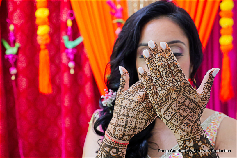Indian bride shows her mehndi design
