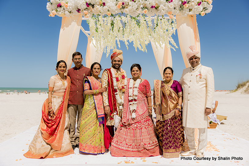 Indian wedding couple with their family