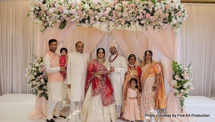 Indian bride and groom with their family