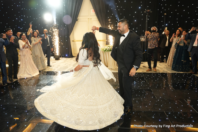 Indian bride and groom enjoying on dance floor