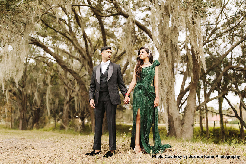 indian wedding couple posing for outdoor photoshoot