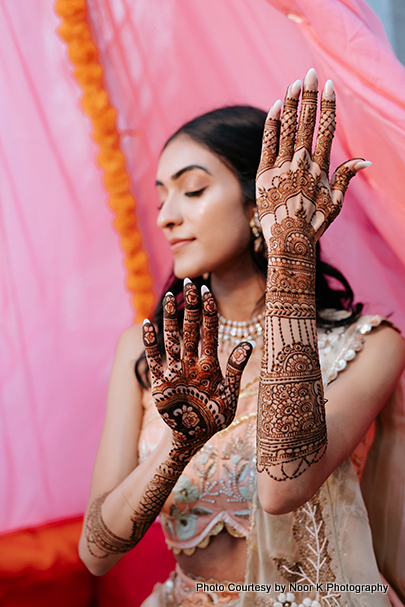 Indian bride showing her mehndi