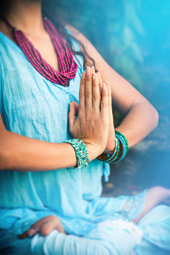 closeup of woman hands in meditative pose practice yoga