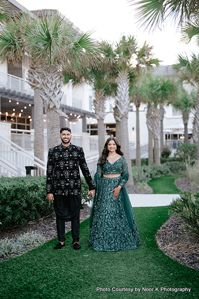 Indian wedding couple holding hands of each other