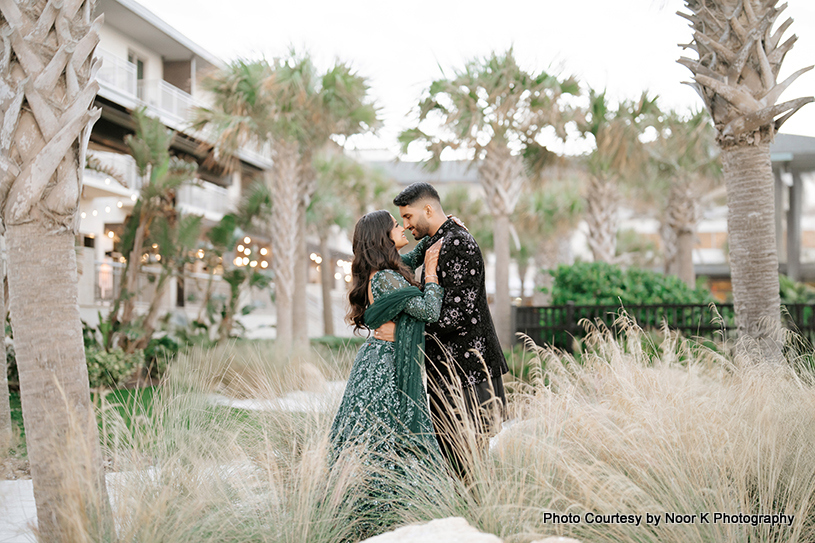 newly weds couple looking in each other's eyes with love