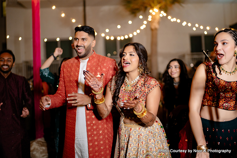 Indian couple enjoying wedding sangeet night
