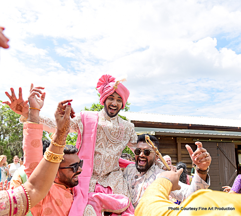 Indian groom dancing with groomsmen