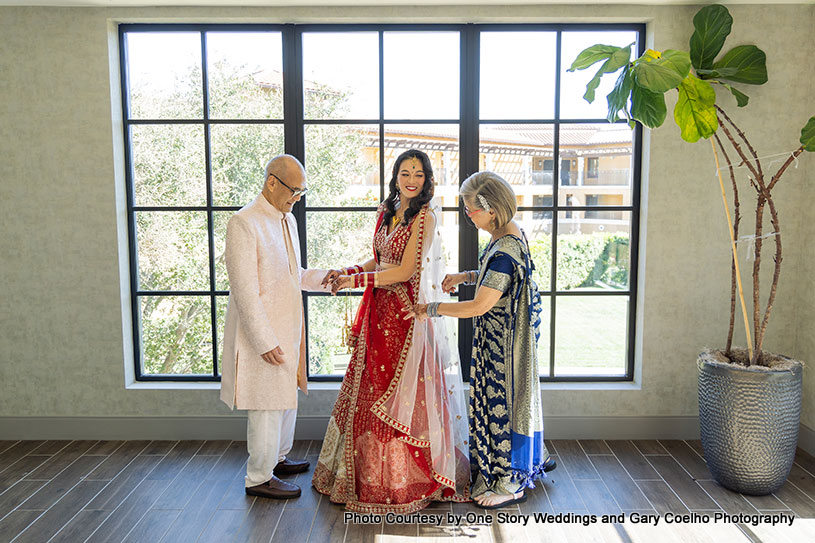 Indian wedding bride with her parents capture