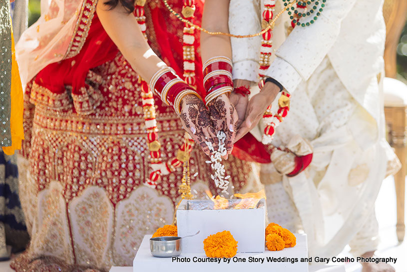 Indian wedding couple performing Indian wedding Ritual 