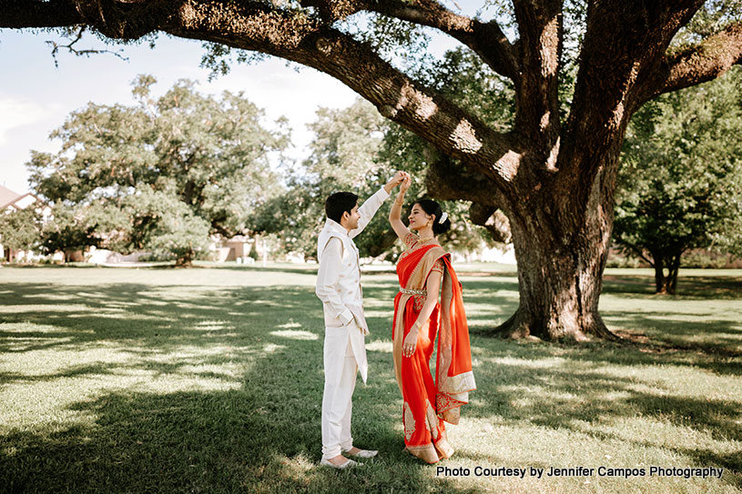Bride and Groom Twirl in the Woods