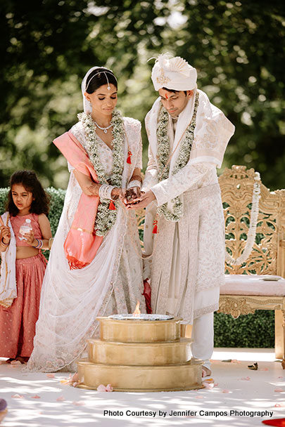 Indian wedding couple performing wedding ritual