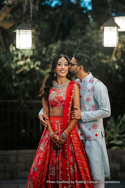 Indian groom showing his love by kissing Indian Bride 