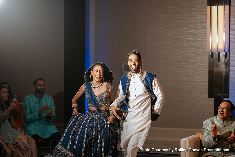 Indian Bride and Groom happily enter on dance floor