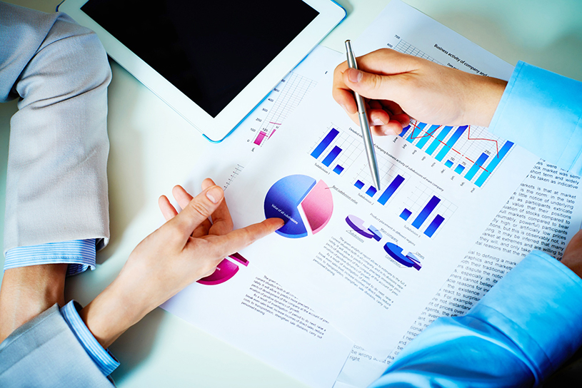 close-up-hands-with-financial-charts-business-meeting 