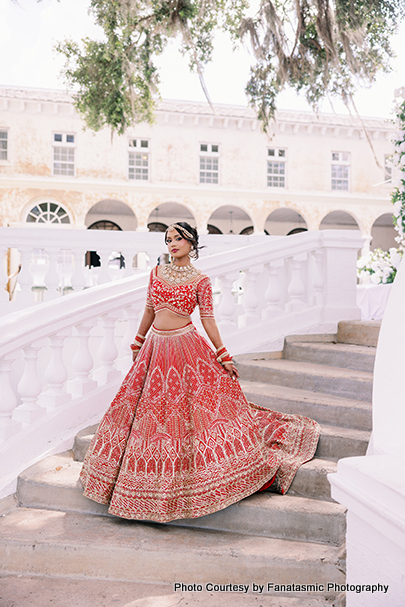 Kashmira in bridal lehenga with intricate jewelry and henna