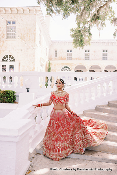 Kashmira in bridal lehenga with intricate jewelry and henna