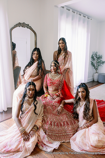 Indian bride posing with bridemaids