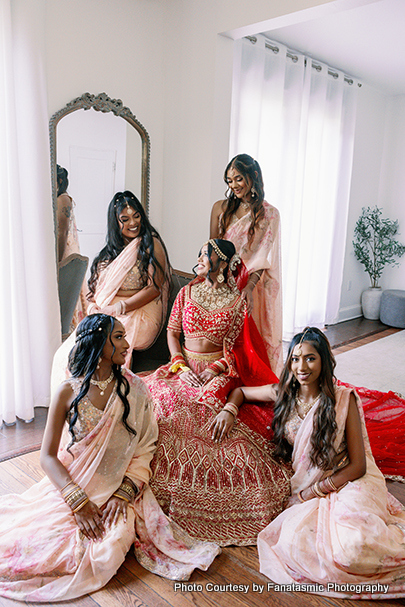 Indian bride posing with bridemaids
