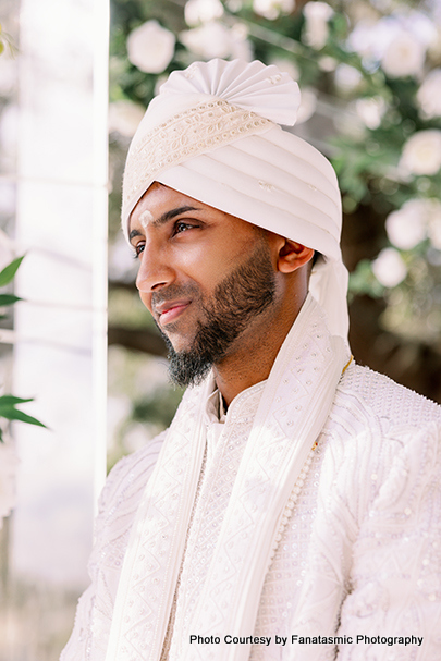 Paul Dhanessur in traditional Indian groom attire with embroidered sherwani and safa