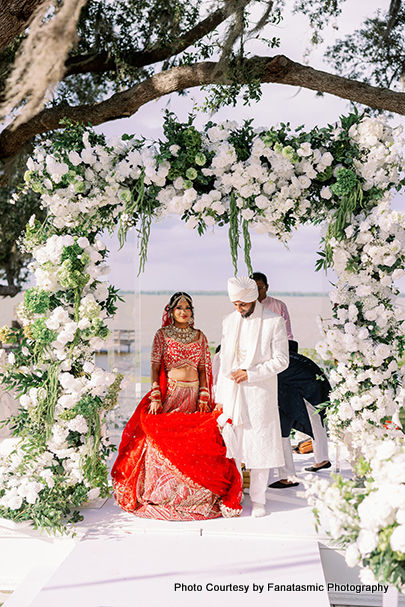 Wedding Ceremony with White and Green Floral Mandap