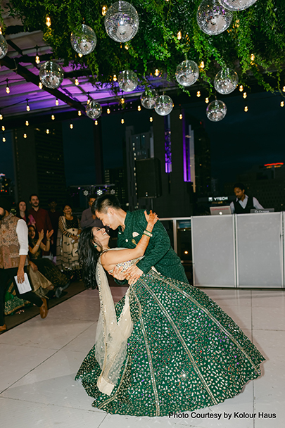Navya and Eddy's reception with red, burgundy, and gold decor in the Granada Ballroom