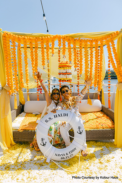 Navya and Eddy celebrating their Haldi ceremony aboard the marigold-decked 'S.S. Haldi' yacht