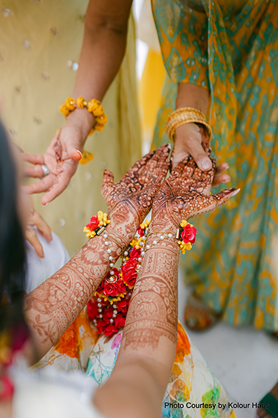 Indian bride shows her mehndi
