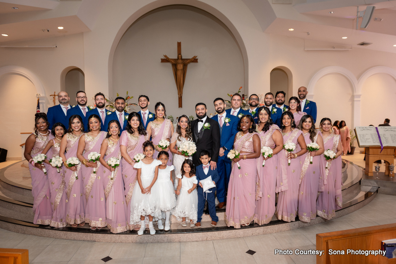 bride, groom posing with bridemaids and groommens