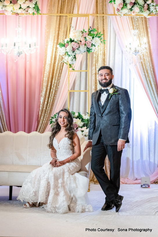 Indian wedding couple at decorated dinning hall