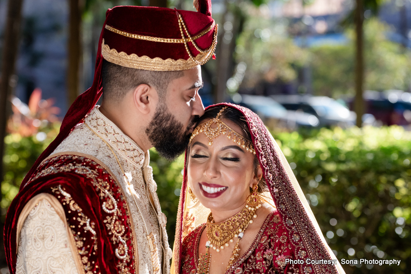 Ashley and Justin sharing a kiss during their sparkler exit at The Royal Crest Room wedding.