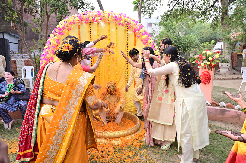 Haldi ceremony under floral canopy