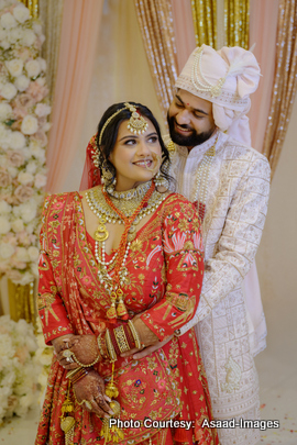 Tithi and Bhaumik close-up portrait smiling during traditional Indian wedding ceremony