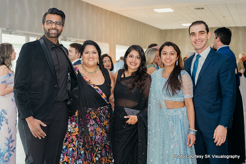Friends posing together at Sujata and Mark wedding celebration
