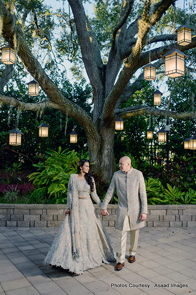 Indian wedding bride and groom express their love by holding eachothers hand